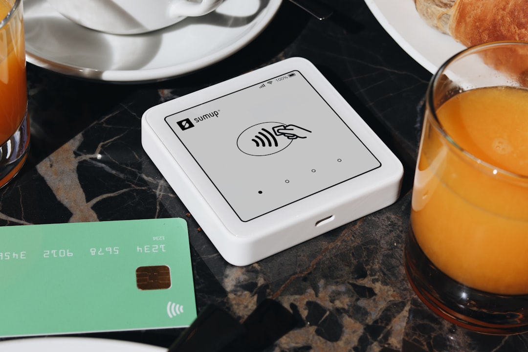 A SumUp card reader is placed on a table, ready to accept contactless payments. The setup is ideal for small businesses and cafés, offering a sleek and efficient way for entrepreneurs to accept payments.