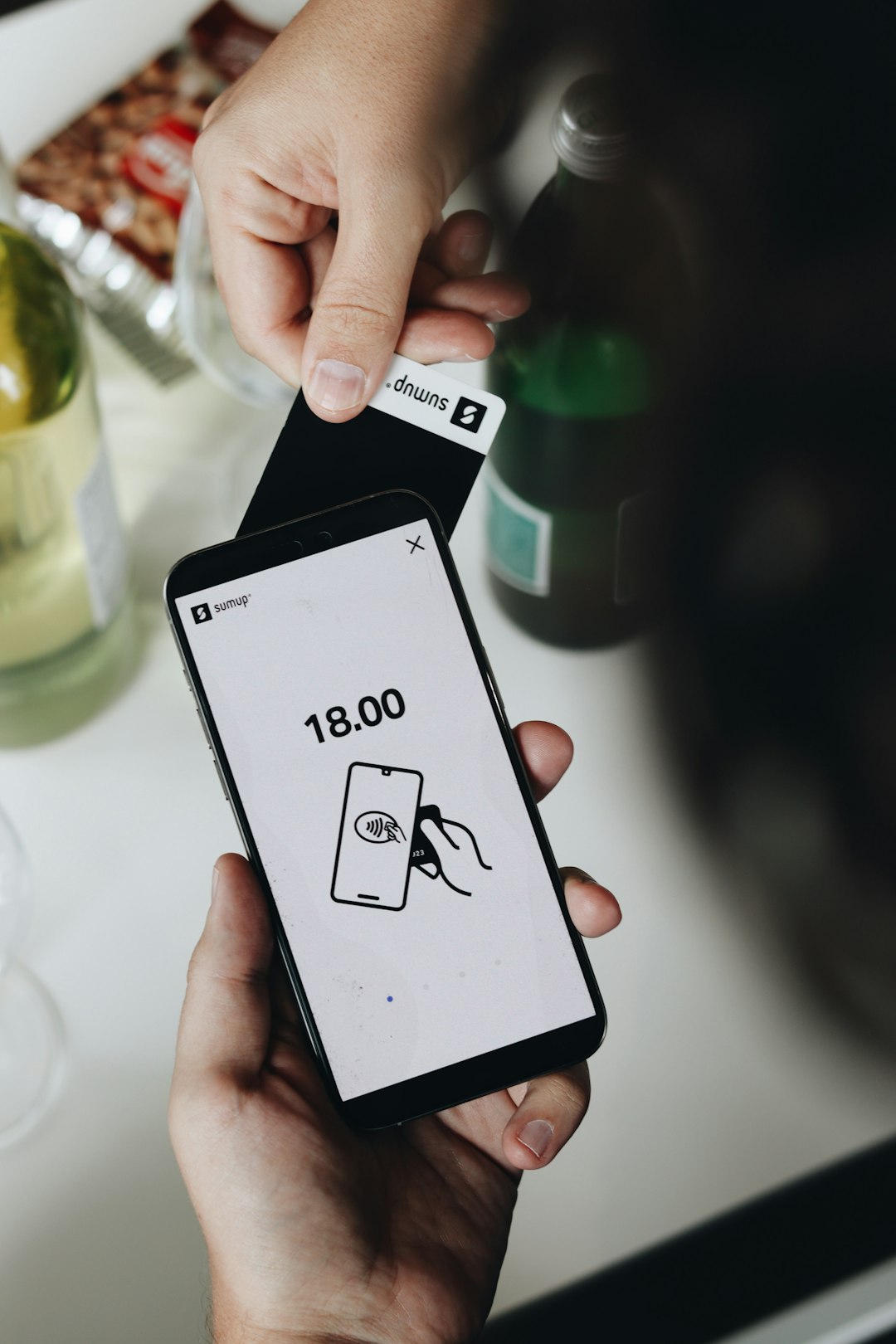 A user makes a contactless payment using the Tap to Pay feature on Android, simplifying transactions for small businesses. This mobile payment solution allows entrepreneurs to accept payments with just a smartphone, without needing extra hardware.